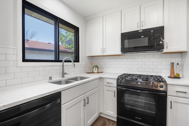 9645 Garrison Way, Eden Prairie, MN 55347 - kitchen featuring black appliances, a sink, light countertops, and white cabinetry
