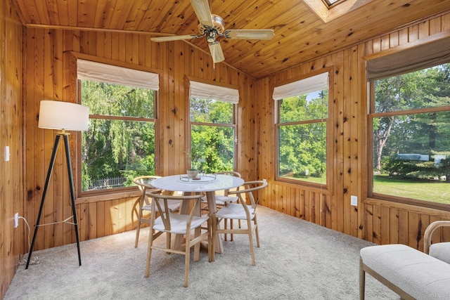 9645 Garrison Way, Eden Prairie, MN 55347 - carpeted dining area featuring wooden walls, a ceiling fan, a skylight, wooden ceiling, and vaulted ceiling