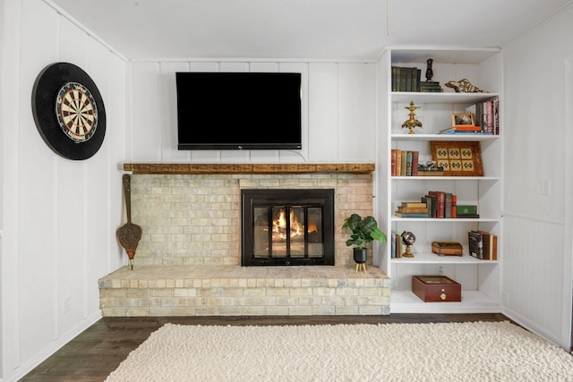 9645 Garrison Way, Eden Prairie, MN 55347 - living area with wood finished floors and a brick fireplace