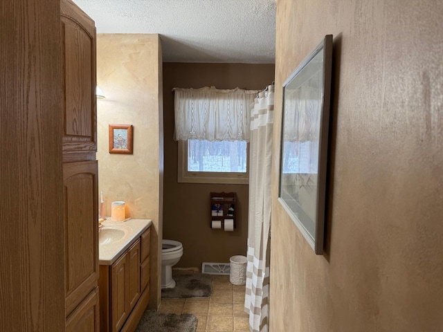 7780 Fawn Lake Dr NE, Stacy, MN 55079 - bathroom featuring toilet, vanity, a textured ceiling, tile patterned flooring, and a shower with curtain