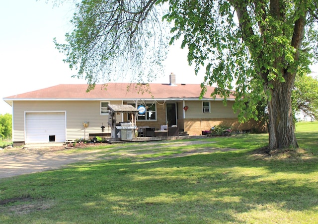 24666 430th St, Browerville, MN 56438 - rear view of property with asphalt driveway, an attached garage, a chimney, and a yard