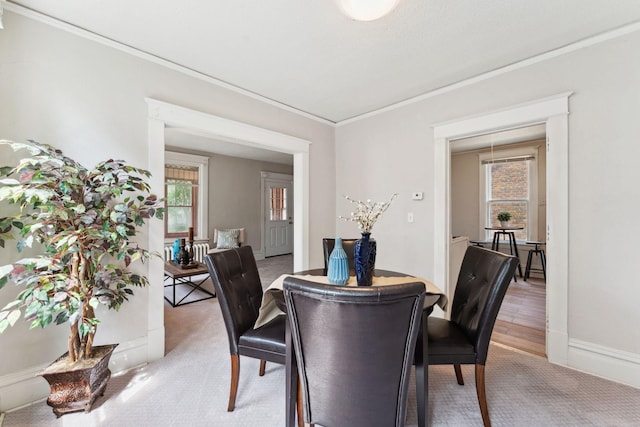 1404 Russell Ave N, Minneapolis, MN 55411 - dining room featuring ornamental molding and light carpet