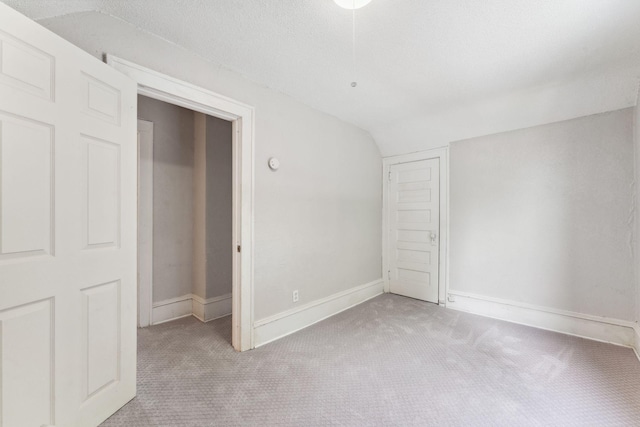 1404 Russell Ave N, Minneapolis, MN 55411 - unfurnished bedroom with carpet, lofted ceiling, baseboards, and a closet