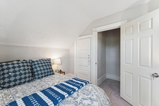 1404 Russell Ave N, Minneapolis, MN 55411 - bedroom featuring carpet floors, vaulted ceiling, and baseboards