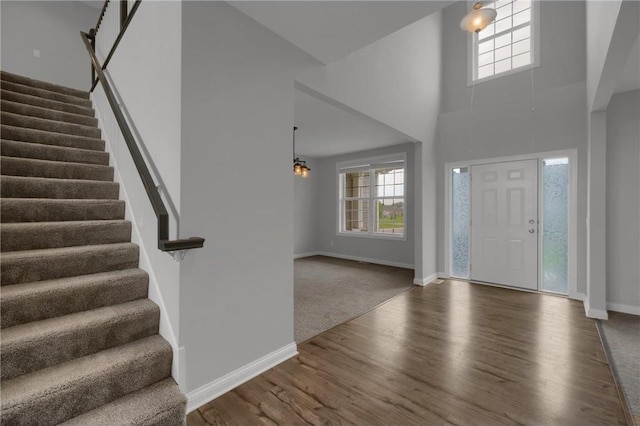 6919 156th St, Savage, MN 55378 - entryway with plenty of natural light, stairway, wood finished floors, and a high ceiling