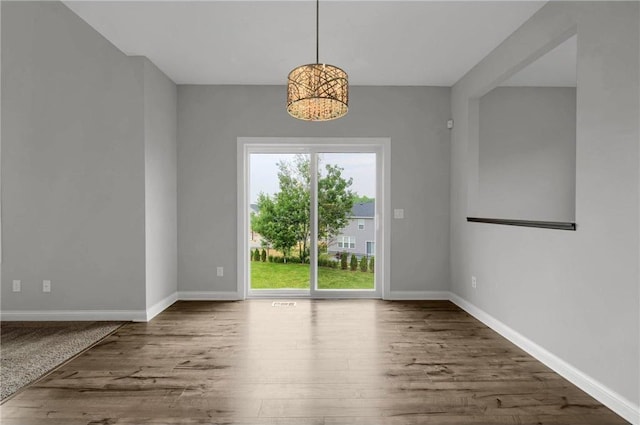6919 156th St, Savage, MN 55378 - unfurnished dining area featuring wood finished floors