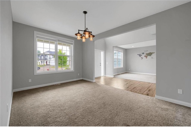 6919 156th St, Savage, MN 55378 - spare room featuring carpet and a chandelier