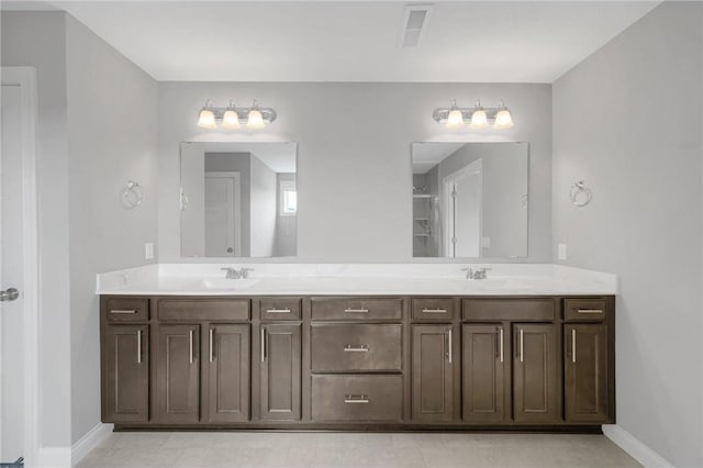 6919 156th St, Savage, MN 55378 - full bathroom featuring double vanity and baseboards