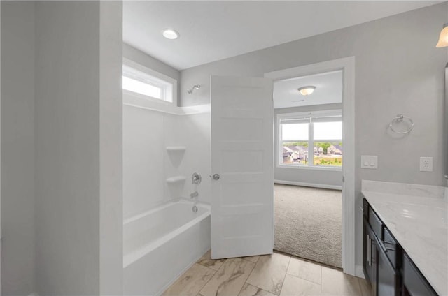 6919 156th St, Savage, MN 55378 - full bath featuring vanity, shower / bathtub combination, healthy amount of natural light, and marble look tile flooring