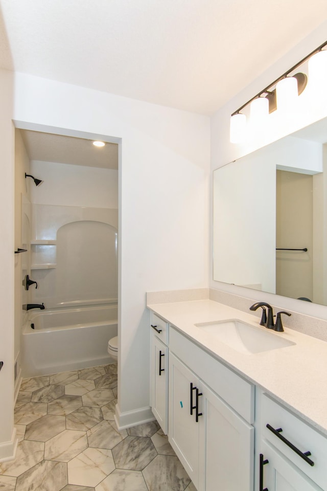 914 Milborne Ln NW, Rochester, MN 55901 - full bathroom with vanity, toilet, marble look tiles, tub / shower combination, and baseboards