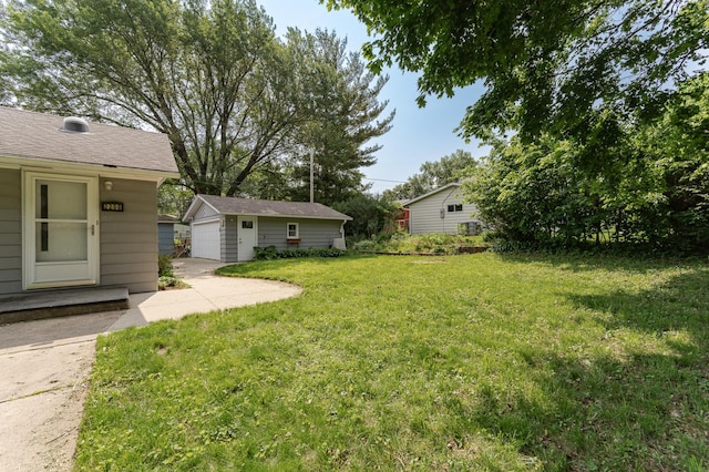 2208 17th Ave NW, Rochester, MN 55901 - view of grassy yard with an outbuilding and a garage