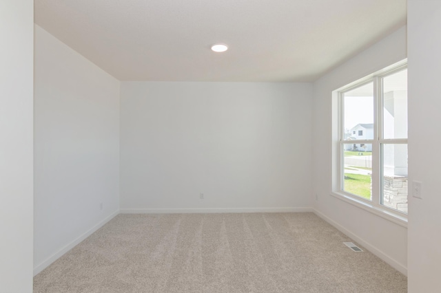 2033 Hadley Hills Dr NE, Rochester, MN 55906 - unfurnished room featuring light carpet and baseboards