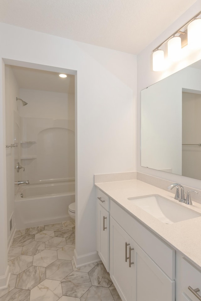 2033 Hadley Hills Dr NE, Rochester, MN 55906 - bathroom with vanity, marble look tiles, toilet, and shower / washtub combination