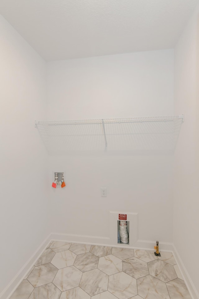 2033 Hadley Hills Dr NE, Rochester, MN 55906 - laundry area with baseboards, hookup for a washing machine, light tile patterned floors, and hookup for a gas dryer