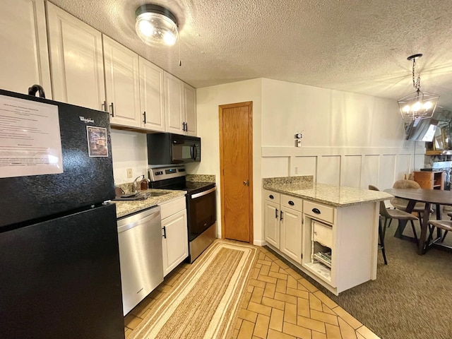 128 Bridge Run Ln Unit B, Lutsen Twp, MN 55612 - kitchen with black appliances, a peninsula, white cabinets, brick patterned flooring, and a textured ceiling
