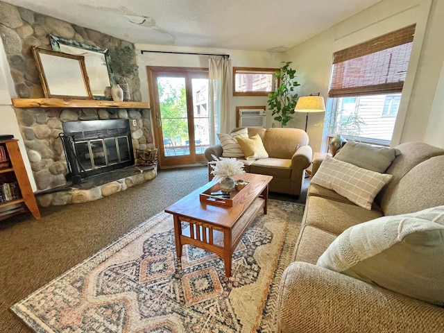 128 Bridge Run Ln Unit B, Lutsen Twp, MN 55612 - carpeted living room featuring a stone fireplace and an AC wall unit