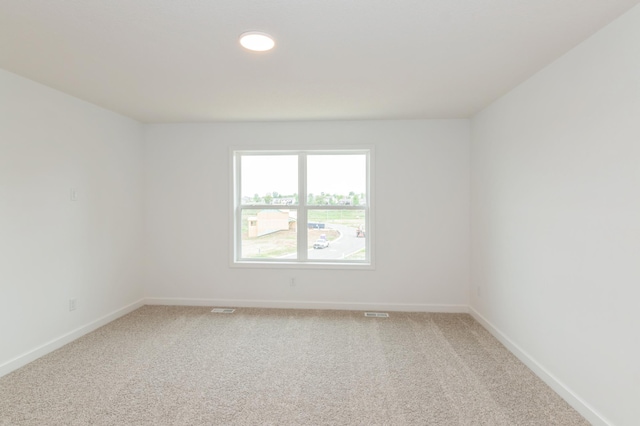 5051 52nd Ave NW, Rochester, MN 55901 - spare room with light carpet, baseboards, and recessed lighting