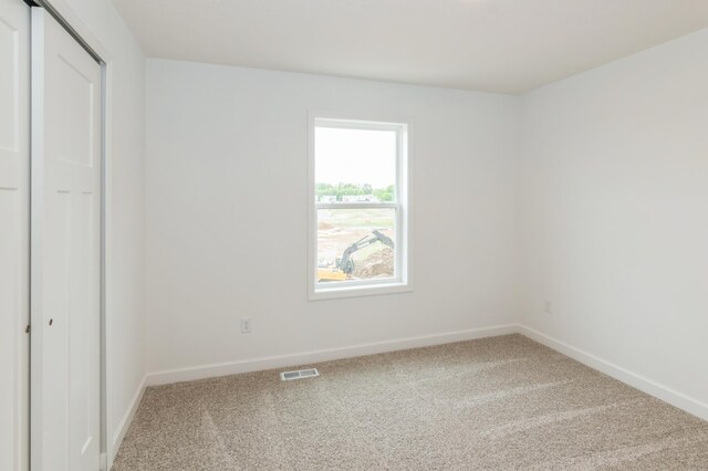5051 52nd Ave NW, Rochester, MN 55901 - unfurnished bedroom featuring carpet flooring, baseboards, and a closet