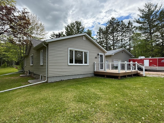 11966 Lindquist Rd, Hibbing, MN 55746 - rear view of house featuring a wooden deck and a lawn