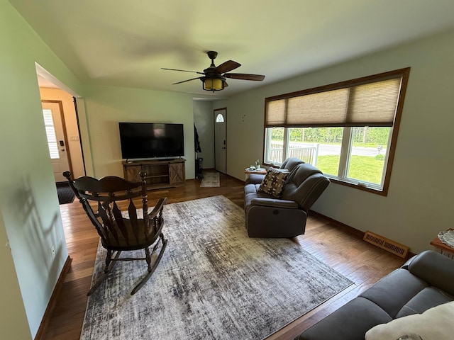 11966 Lindquist Rd, Hibbing, MN 55746 - living area with baseboards, wood finished floors, and a ceiling fan