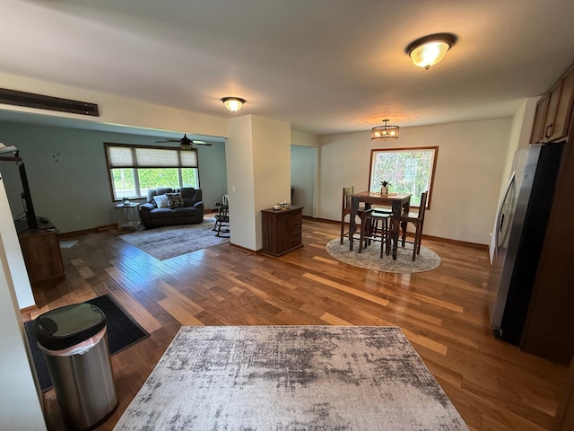 11966 Lindquist Rd, Hibbing, MN 55746 - dining area with healthy amount of natural light, wood finished floors, ceiling fan, and baseboards