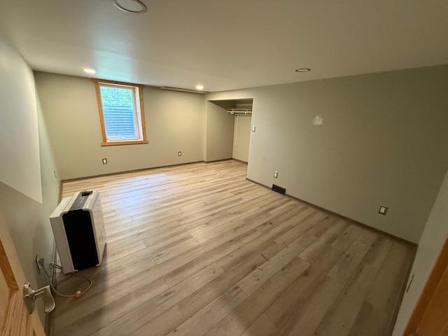 11966 Lindquist Rd, Hibbing, MN 55746 - unfurnished bedroom featuring light wood-style flooring, heating unit, and recessed lighting