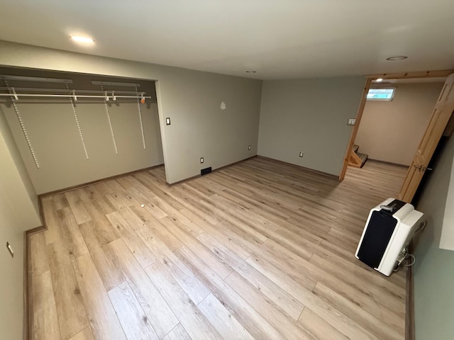 11966 Lindquist Rd, Hibbing, MN 55746 - unfurnished bedroom with heating unit, light wood-type flooring, baseboards, and recessed lighting
