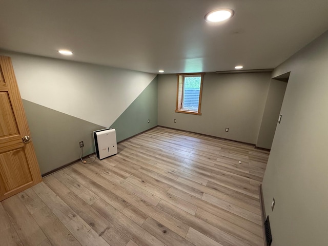 11966 Lindquist Rd, Hibbing, MN 55746 - below grade area featuring light wood-type flooring, recessed lighting, and baseboards