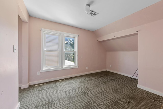 517 1st Ave NW, Winnebago, MN 56098 - bonus room featuring carpet floors, lofted ceiling, and baseboards