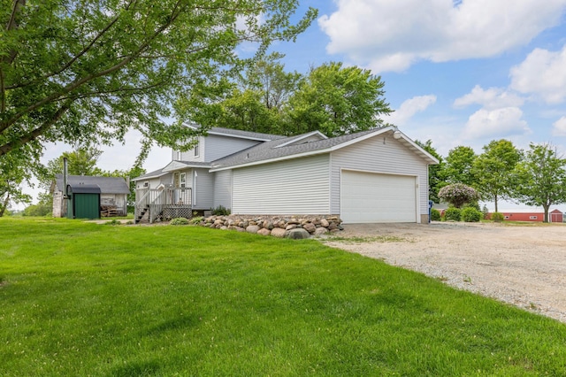 8187 230th St E, Faribault, MN 55021 - view of front of house featuring driveway, a garage, a front lawn, and a shingled roof