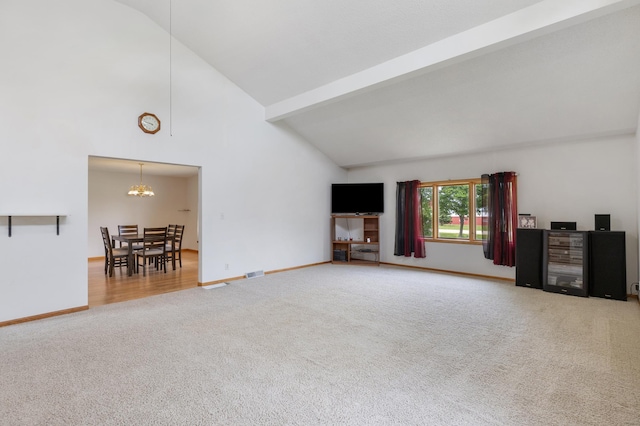 8187 230th St E, Faribault, MN 55021 - unfurnished living room with carpet floors, high vaulted ceiling, baseboards, a chandelier, and beamed ceiling