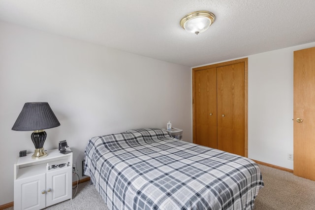 8187 230th St E, Faribault, MN 55021 - bedroom featuring light carpet, baseboards, and a closet