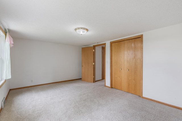 8187 230th St E, Faribault, MN 55021 - unfurnished bedroom with carpet flooring, a closet, and baseboards