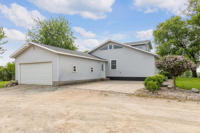 8187 230th St E, Faribault, MN 55021 - view of property exterior with a garage and driveway