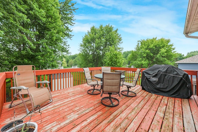 810 7th Ave N, Sauk Rapids, MN 56379 - wooden deck with outdoor dining area and area for grilling
