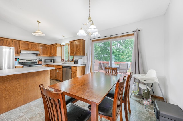 810 7th Ave N, Sauk Rapids, MN 56379 - dining space featuring a chandelier and vaulted ceiling