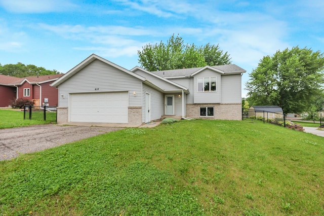 810 7th Ave N, Sauk Rapids, MN 56379 - split level home featuring a garage, a front yard, and brick siding