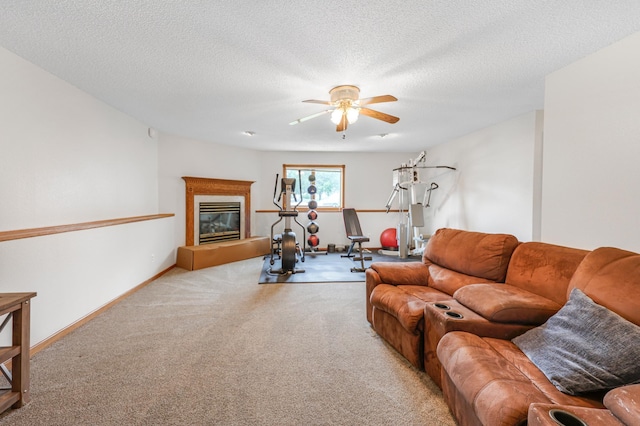 810 7th Ave N, Sauk Rapids, MN 56379 - carpeted living room with ceiling fan, a glass covered fireplace, and a textured ceiling