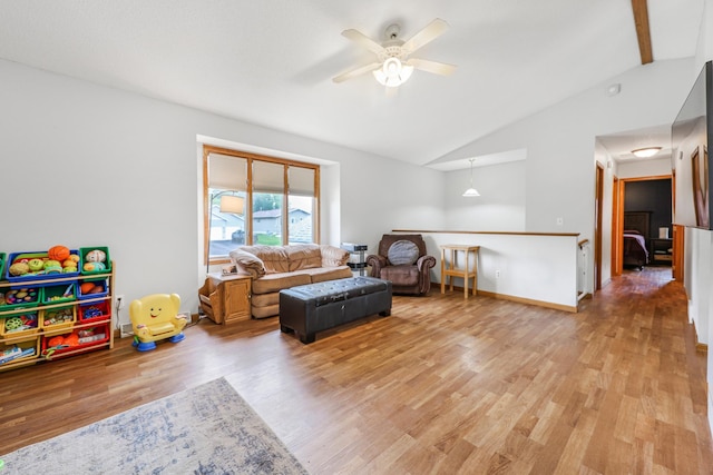 810 7th Ave N, Sauk Rapids, MN 56379 - living area featuring vaulted ceiling, ceiling fan, light wood-style flooring, and baseboards