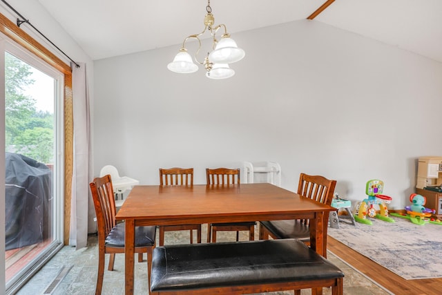 810 7th Ave N, Sauk Rapids, MN 56379 - dining space with lofted ceiling, a chandelier, and light wood-style flooring