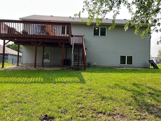 810 7th Ave N, Sauk Rapids, MN 56379 - rear view of property with a deck, a yard, stairway, and central air condition unit