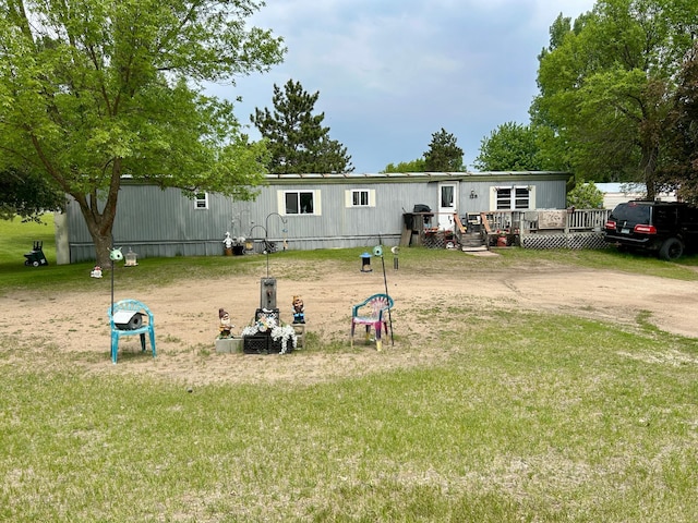128 Park Cir, Ottertail, MN 56571 - back of house with a deck and a lawn