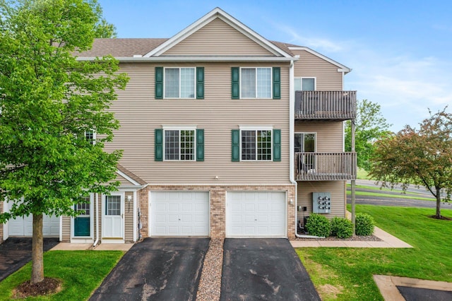 16047 72nd St NE, Otsego, MN 55330 - view of property featuring asphalt driveway, a garage, a front lawn, a balcony, and brick siding
