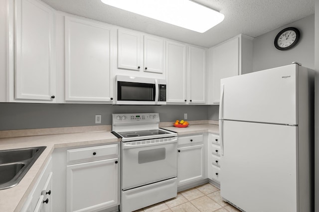 16047 72nd St NE, Otsego, MN 55330 - kitchen with white appliances, white cabinets, light countertops, a textured ceiling, and a sink