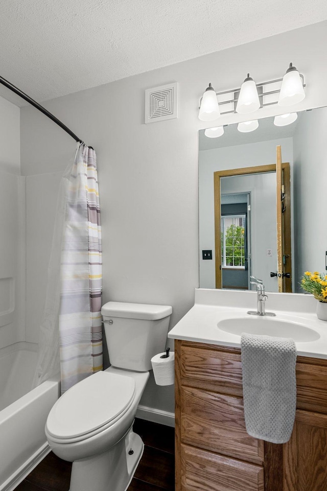 16047 72nd St NE, Otsego, MN 55330 - bathroom featuring vanity, toilet, shower / bathtub combination with curtain, wood finished floors, and a textured ceiling