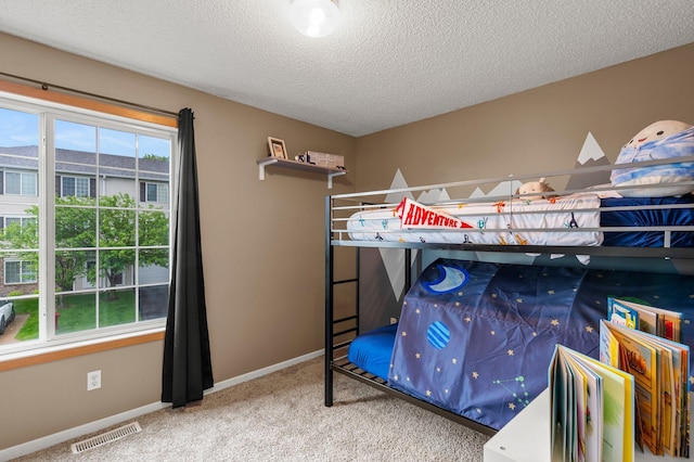 16047 72nd St NE, Otsego, MN 55330 - carpeted bedroom with a textured ceiling and baseboards