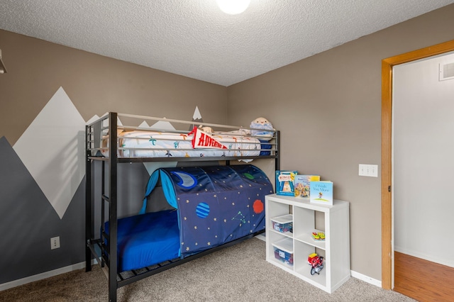 16047 72nd St NE, Otsego, MN 55330 - bedroom featuring a textured ceiling, carpet flooring, and baseboards