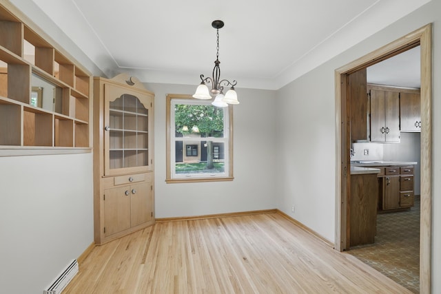 5652 Thomas Ave S, Minneapolis, MN 55410 - unfurnished dining area featuring light wood finished floors, a chandelier, and baseboards