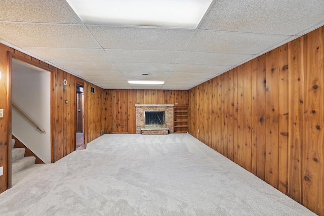 5652 Thomas Ave S, Minneapolis, MN 55410 - finished basement featuring carpet floors, wood walls, a brick fireplace, stairs, and a drop ceiling