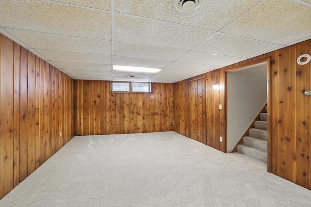 5652 Thomas Ave S, Minneapolis, MN 55410 - below grade area with carpet floors, stairway, wood walls, and a paneled ceiling